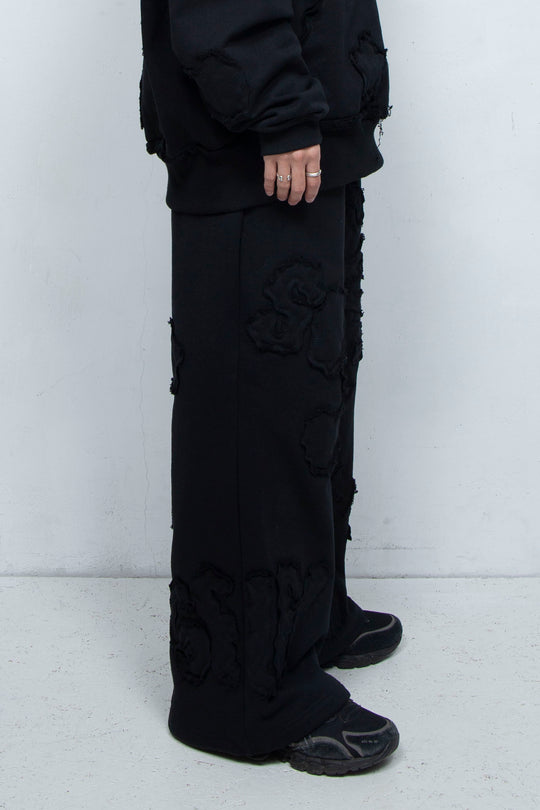 Multi-pattern raw edge sweatpants BLACK