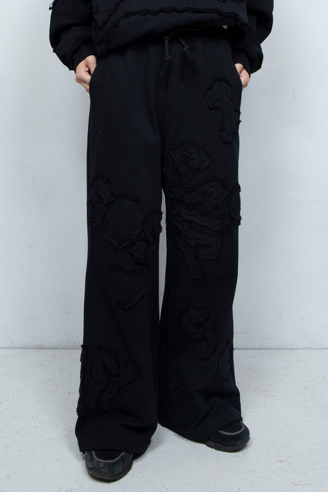 Multi-pattern raw edge sweatpants BLACK
