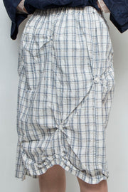 Asymmetric check skirt