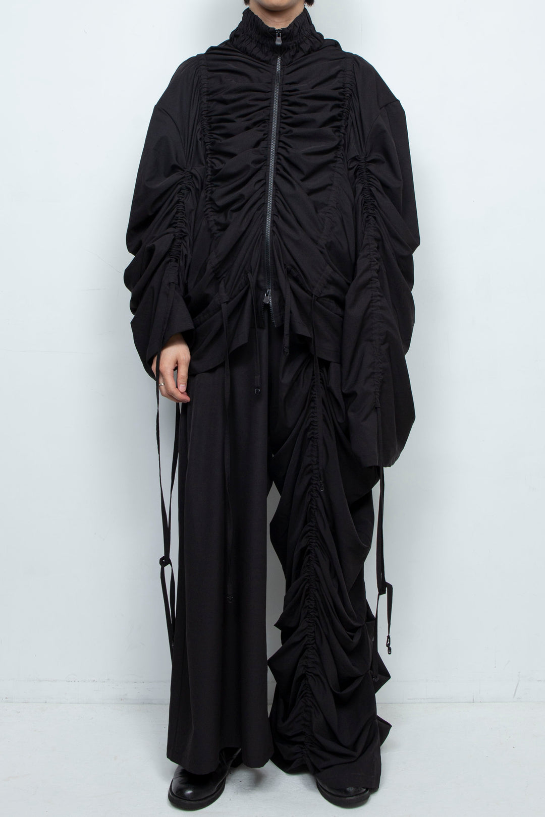 BLACK WIDE-LEG ASYMMETRIC GATHERED PANEL TROUSERS