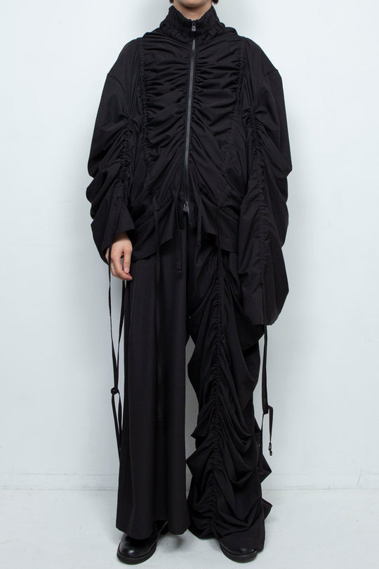 BLACK WIDE-LEG ASYMMETRIC GATHERED PANEL TROUSERS