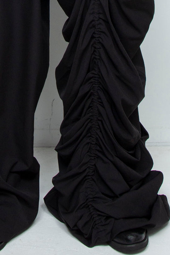 BLACK WIDE-LEG ASYMMETRIC GATHERED PANEL TROUSERS