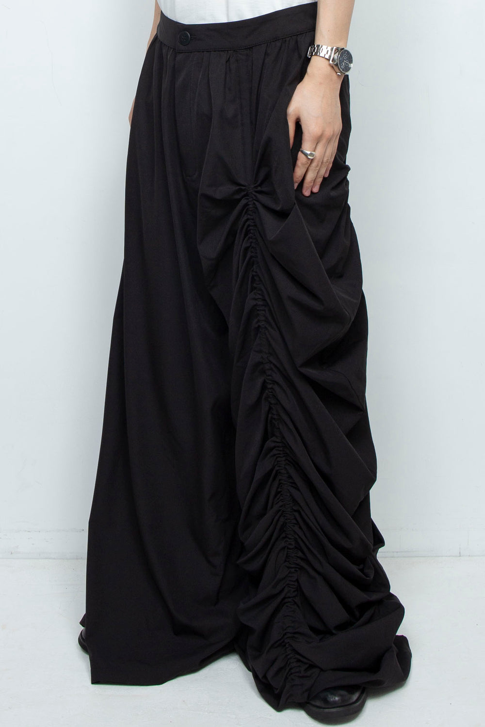 BLACK WIDE-LEG ASYMMETRIC GATHERED PANEL TROUSERS