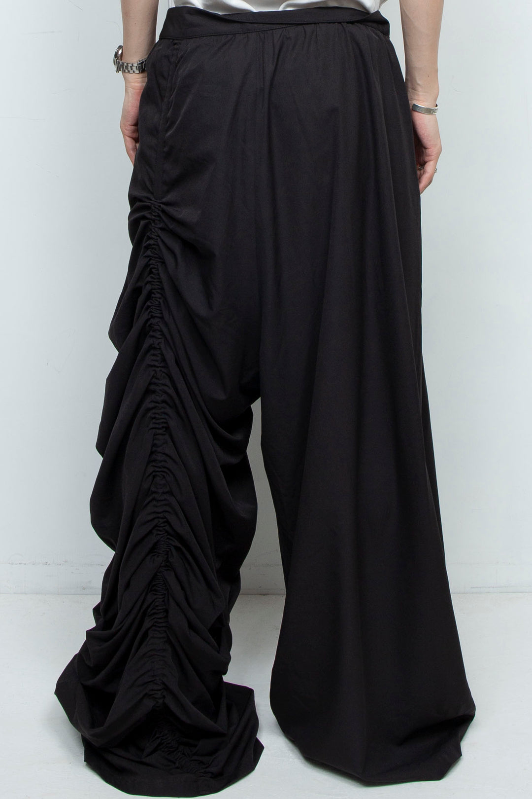 BLACK WIDE-LEG ASYMMETRIC GATHERED PANEL TROUSERS