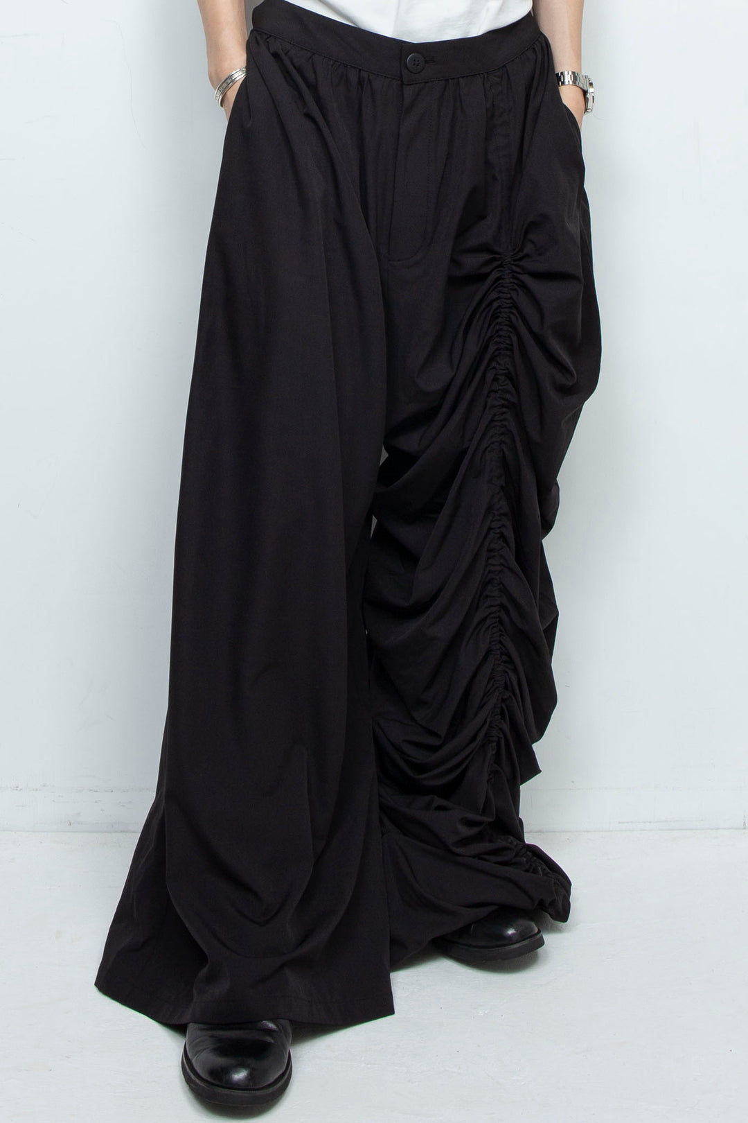 BLACK WIDE-LEG ASYMMETRIC GATHERED PANEL TROUSERS