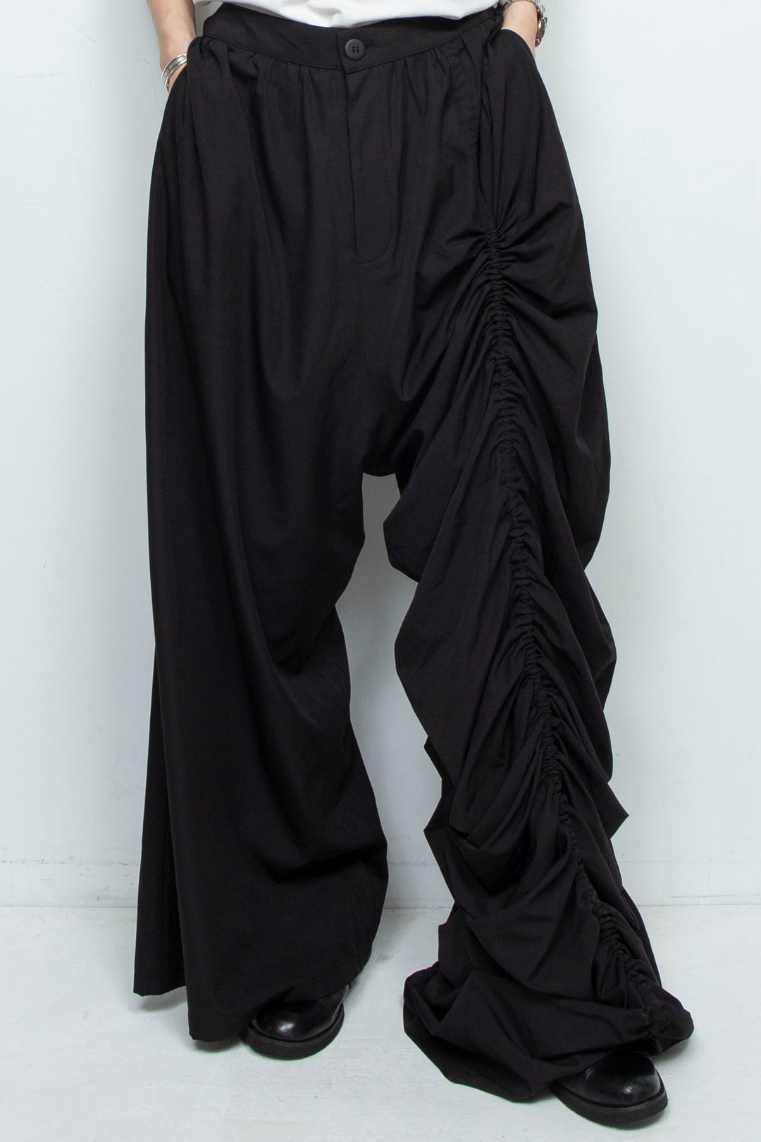 BLACK WIDE-LEG ASYMMETRIC GATHERED PANEL TROUSERS