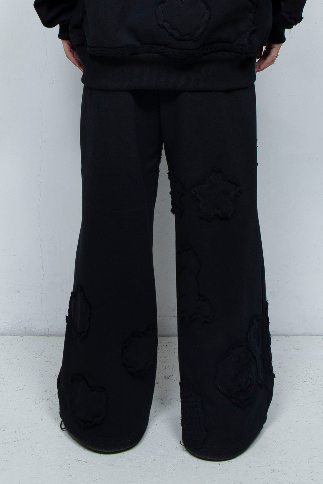 Multi-pattern raw edge sweatpants BLACK