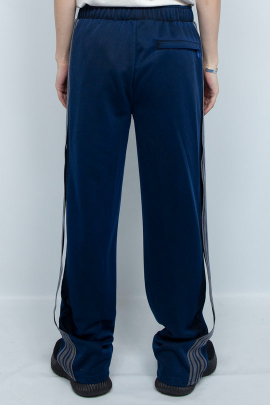 PIGMENT-DYED DISTRESSED TRACK TROUSERS BLUE