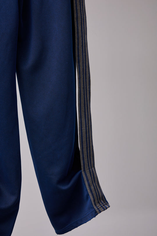 PIGMENT-DYED DISTRESSED TRACK TROUSERS BLUE