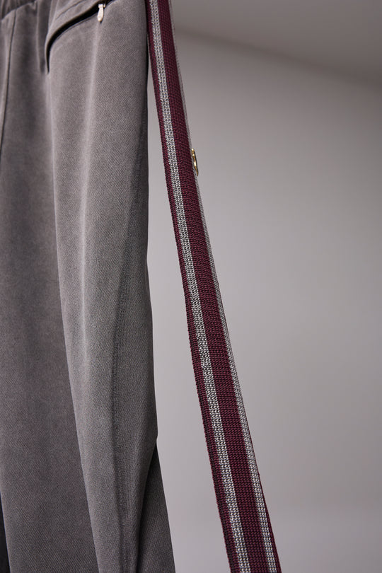 PIGMENT-DYED DISTRESSED TRACK TROUSERS GRAY